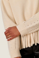 Rebecca Taylor Emelia fringe sweater in alabaster, showcasing soft knit fabric with fringe details on the hem and sleeves.