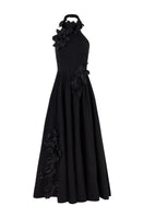 AISA luminous gown with flowing fabric and intricate detailing, showcased on a dress form against a neutral background.