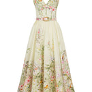 AISA Gardenia floral midi dress displayed on a hanger, showcasing its lightweight fabric and vibrant floral pattern.