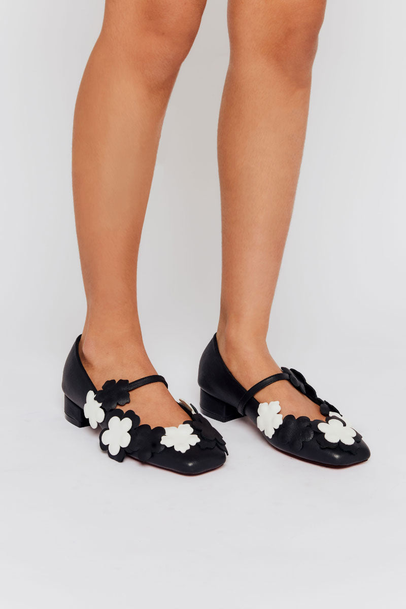 Christin Wu Yardene heels with pointed toe and sleek design, showcasing elegant black footwear on a neutral background.