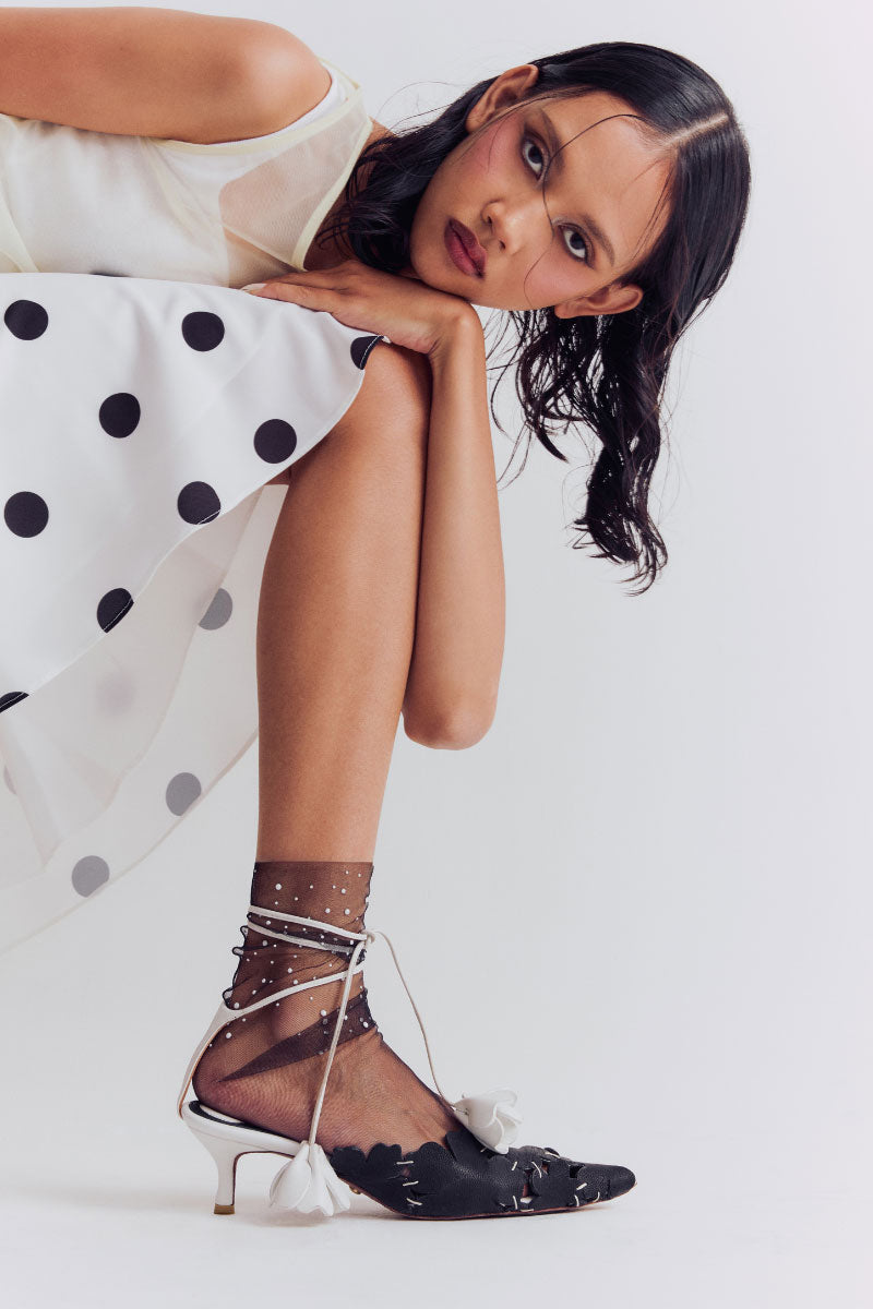 Christin Wu YASELLE heels worn in a lifestyle setting, showcasing stylish high-heeled footwear with elegant design.