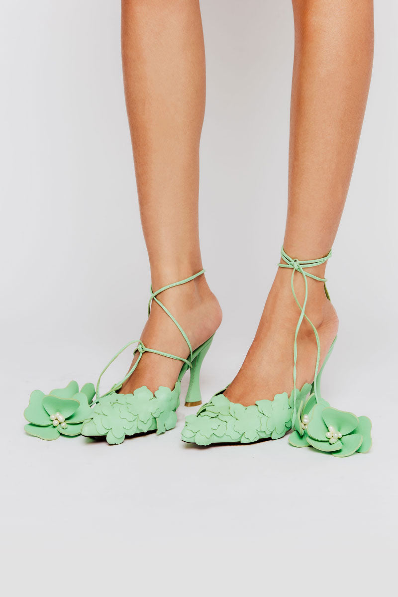 Black Christin Wu Yeesha heels featuring pointed toes and sleek stiletto heels, displayed on a neutral background.