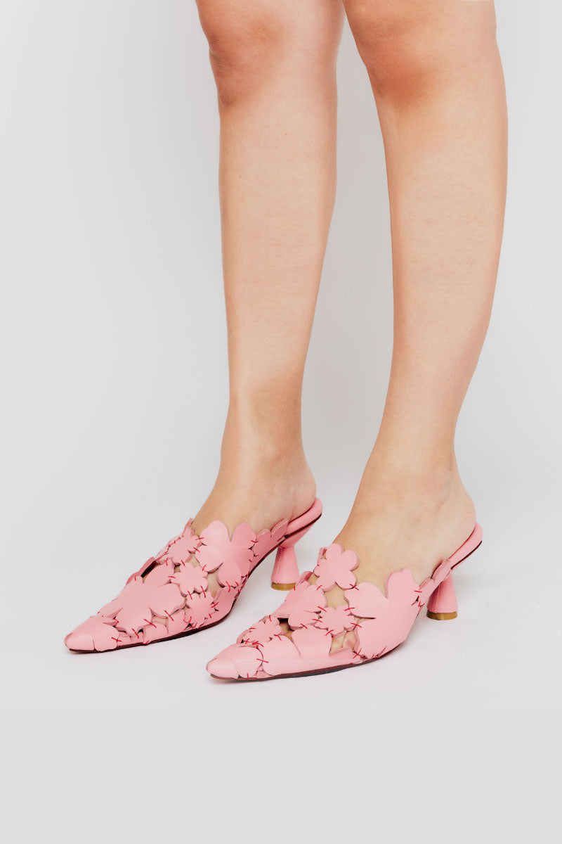 Christin Wu YEMIMA heels featuring sleek design and pointed toes, shown in a stylish black leather finish.