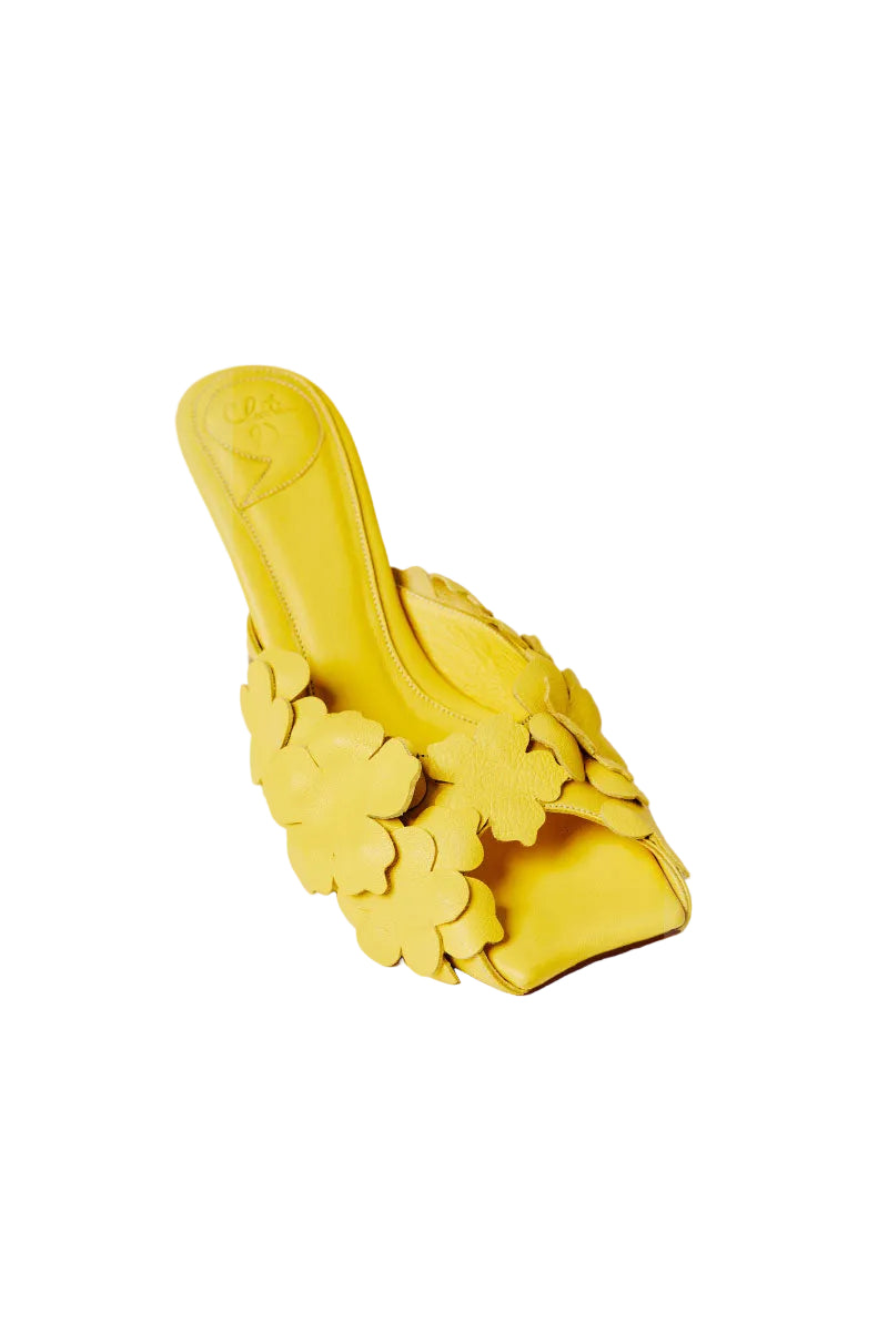 Yellow Christin Wu YUKI heels sandals featuring stylish open-toe design and ankle straps, displayed on a neutral background.