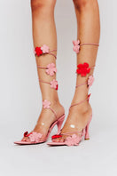 Christin Wu Yurelle Heels sandals with stylish straps and open toes, displayed on a neutral background.
