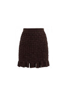 Brown Yara mini skirt by Maylé Vásquez, stylish short skirt with a fitted waistband and smooth fabric.