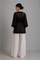 Back view of First Born Knits Yoko Resort Jacket in black, showcasing the relaxed fit and stylish design.