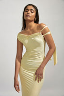Yellow maxi dress by Deme By Gabriella featuring a flowing silhouette and elegant design, perfect for casual or formal occasions.