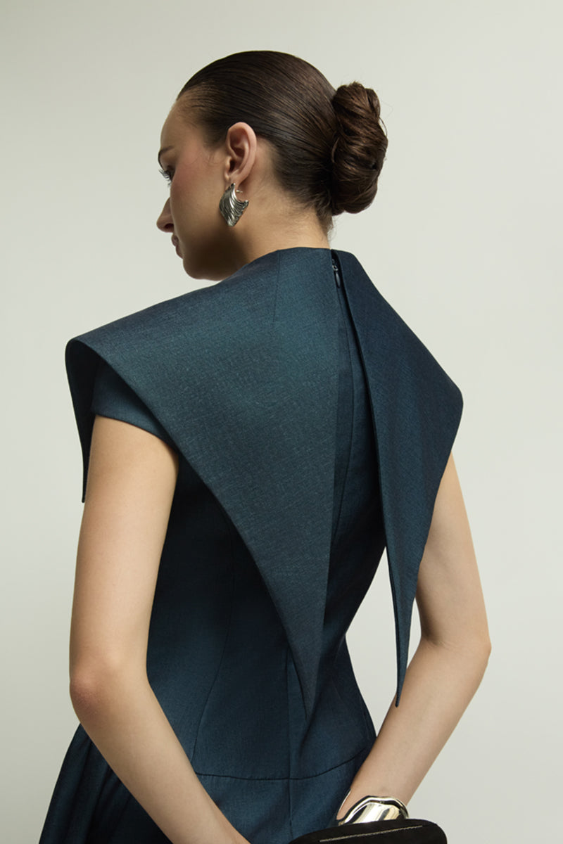 Dark blue Zelie jumpsuit by Jenny K Tran, showcasing a stylish, fitted jumpsuit with elegant design and modern silhouette.