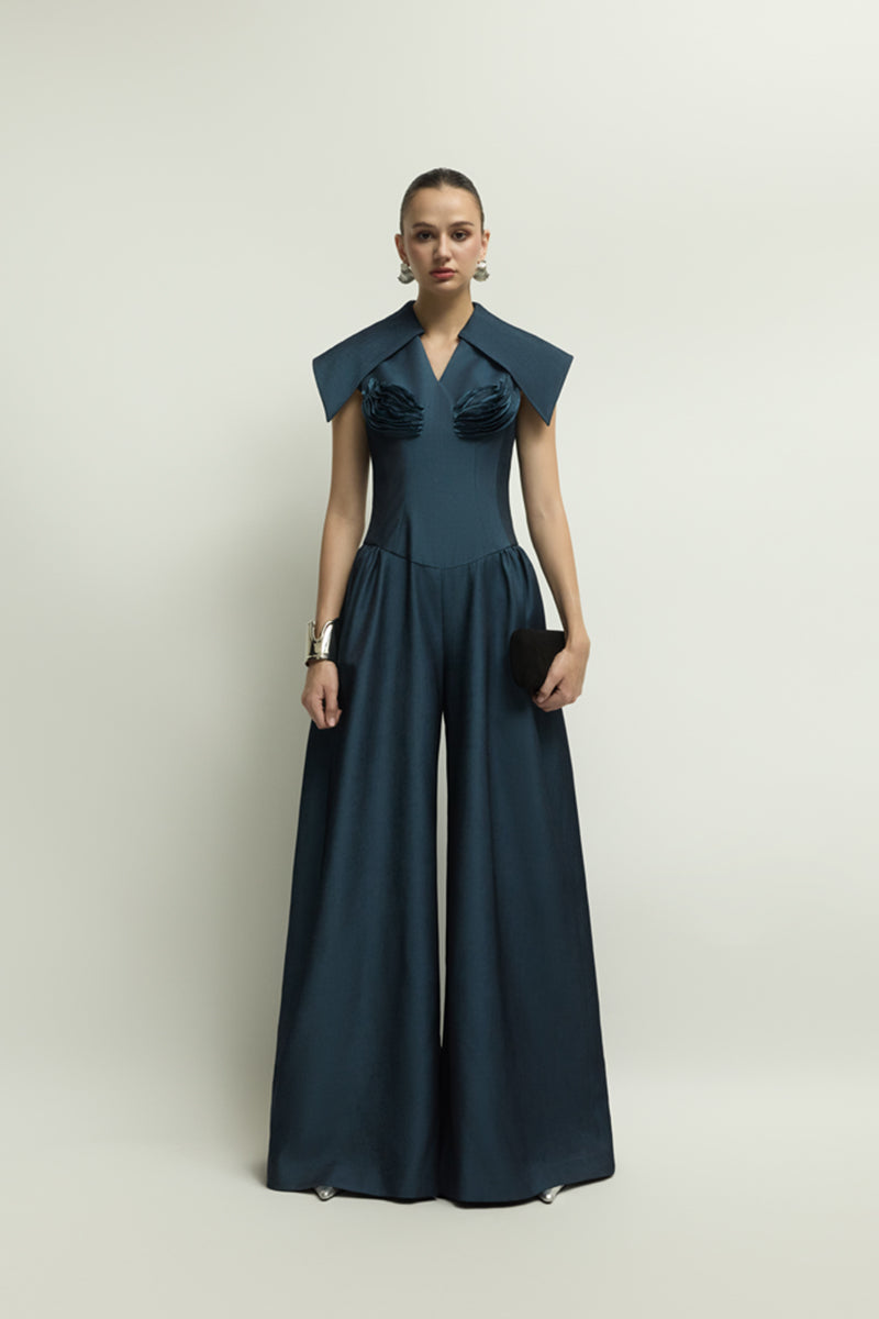 Dark blue Zelie jumpsuit by Jenny K Tran, featuring a stylish and comfortable design, shown on a model with a fitted silhouette.