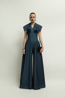 Dark blue Zelie jumpsuit by Jenny K Tran, featuring a stylish and comfortable design, shown on a model with a fitted silhouette.