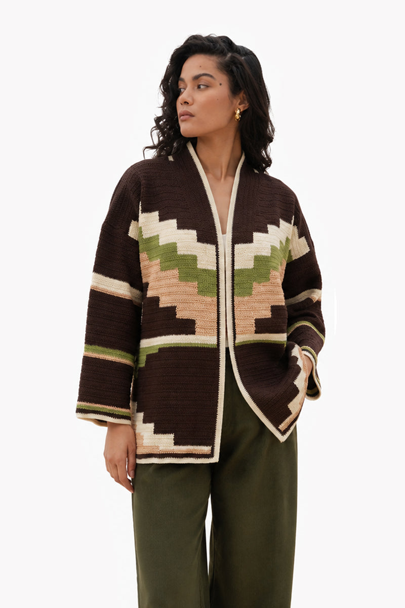 Jessica K ZINA brown cardigan jacket displayed on a hanger, showcasing its soft knit fabric and classic design.