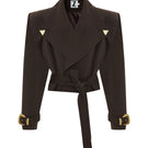 Brown oversized mini trench jacket by Zeynep Tosun, front view showcasing classic collar and belted waist.