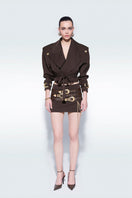 Brown oversized mini trench jacket by Zeynep Tosun, featuring classic collar and button details, styled for a modern look.