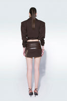 Zeynep Tosun oversized mini trench jacket in brown, lightweight with classic collar and button details, front view.