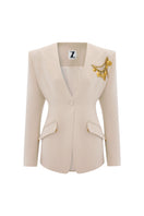 Beige Zeynep Tosun sea shell jacket with front view, stylish design, and textured fabric, perfect for a chic outerwear look.