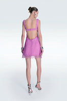 Pink strapless mini dress by Zeynep Tosun with detailed corset design, perfect for stylish, elegant occasions.