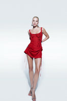 Zeynep Tosun Rosetta Red mini dress shown on a hanger, featuring a fitted silhouette and stylish design details.