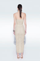 Beige strapless corset midi dress by Zeynep Tosun, shown on a model, featuring a fitted bodice and elegant midi length.