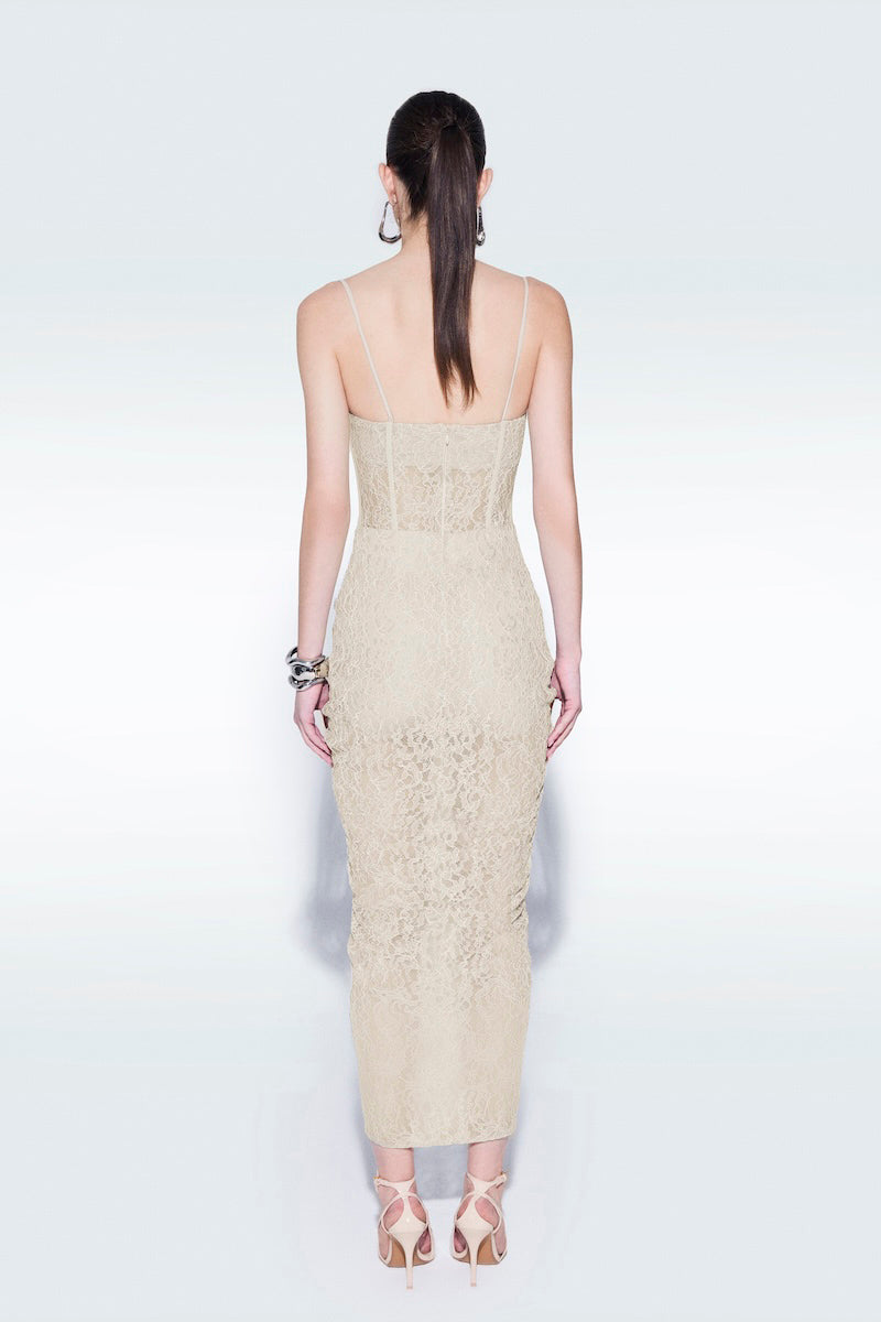Beige strapless corset midi dress by Zeynep Tosun, shown on a model, featuring a fitted bodice and elegant midi length.