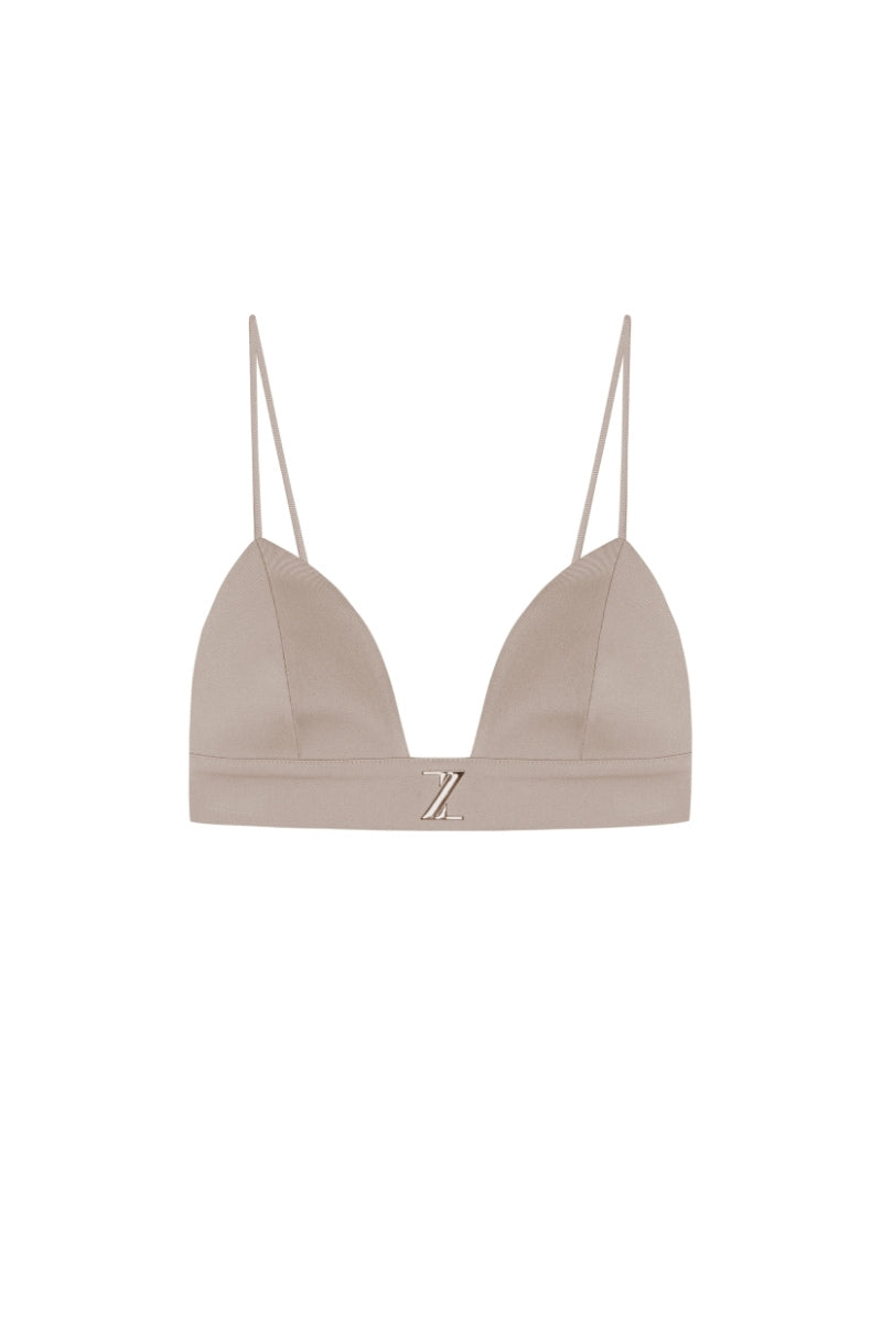Beige gabardine bra top by Zeynep Tosun with structured design and soft fabric, shown from the front.