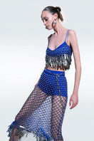 Hand-knitted blue top by Zeynep Tosun, featuring a textured design and long sleeves, perfect for casual or elegant outfits.