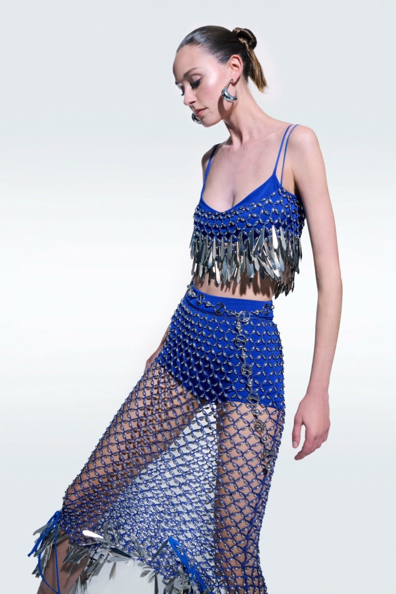 Hand-knitted blue top by Zeynep Tosun, featuring a textured design and long sleeves, perfect for casual or elegant outfits.