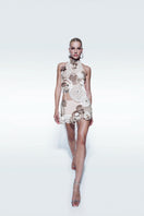 Off-white asymmetrical broderie top by Zeynep Tosun, featuring intricate embroidery and a stylish, modern design.