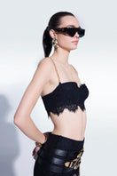 Black mini lace bra top by Zeynep Tosun, featuring delicate lace details and a fitted design, perfect for stylish tops.