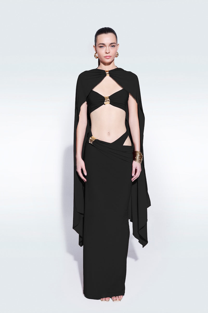 Black draped top with cape detail by Zeynep Tosun, stylish women's fashion top showcasing elegant draping and modern design.