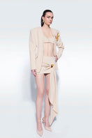 Beige basic logo top by Zeynep Tosun, featuring a simple design and comfortable fit, shown on a model.