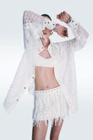 Zeynep Tosun broderie off-white mini skirt with intricate embroidery, stylish and elegant for fashion-forward looks.