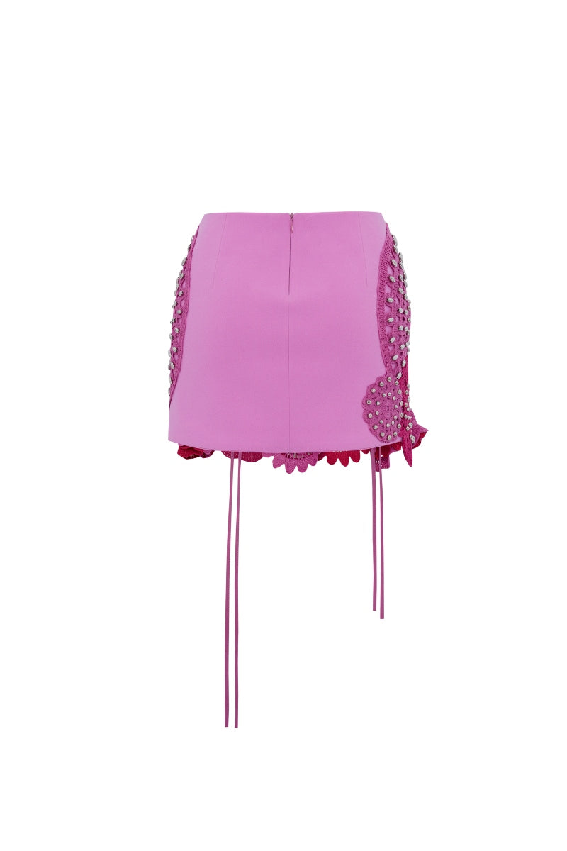 Pink floral mini skirt by Zeynep Tosun, back view showcasing delicate floral pattern and fitted waistband.