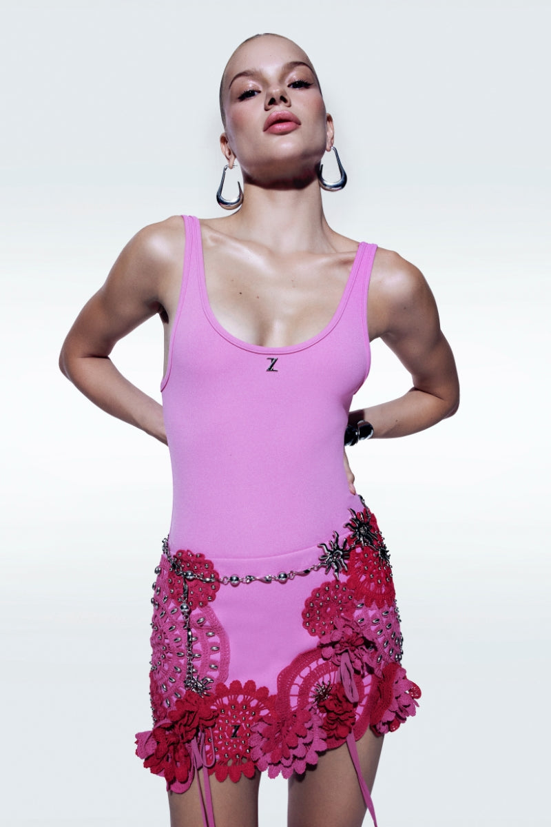 Pink floral fancy mini skirt by Zeynep Tosun, featuring a stylish and vibrant design perfect for trendy summer outfits.
