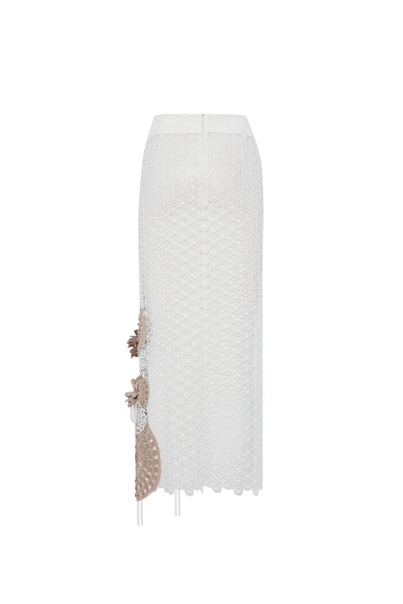 Zeynep Tosun midi length broderie skirt in off-white, featuring intricate embroidery and flowing fabric, back view.