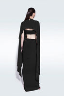 Black draped maxi skirt by Zeynep Tosun, flowing fabric with elegant draping and a full-length silhouette.