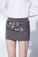Gray mini skirt with belts by Zeynep Tosun, featuring stylish design and fitted silhouette.