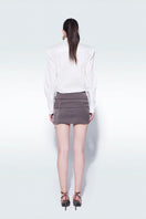 Gray mini skirt with belt detail by Zeynep Tosun, showcasing a stylish and fitted design with belt accents.