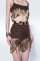 Hand-knit metallic brown mini skirt by Zeynep Tosun, featuring a textured knit pattern and a stylish, fitted silhouette.