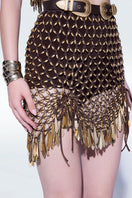 Hand-knit metallic brown mini skirt by Zeynep Tosun, showing close-up of textured knit fabric and metallic sheen.