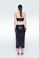 Black lace midi skirt with attached belts from Zeynep Tosun, featuring intricate lace details and a stylish, elegant design.