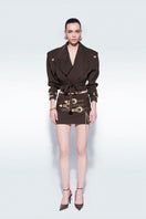 Brown mini skirt with stylish belts by Zeynep Tosun, featuring a fitted design and fashionable details.