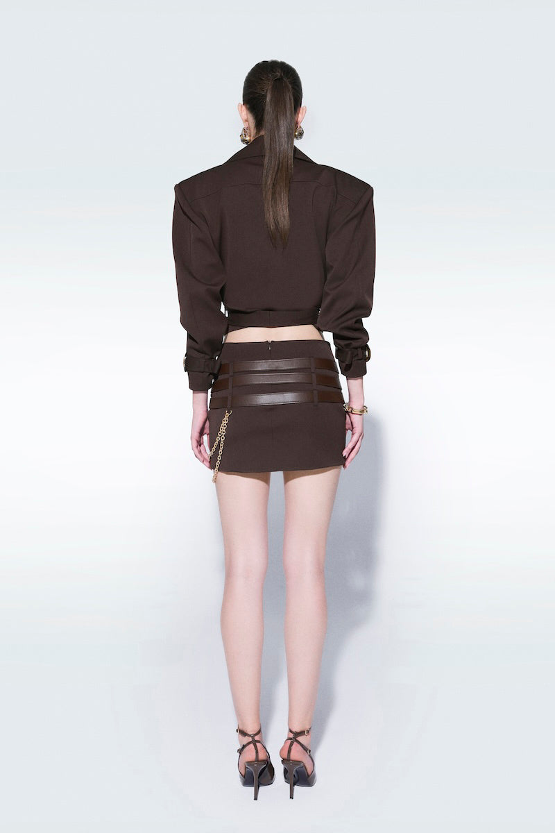 Brown mini skirt with belts from Zeynep Tosun, featuring a stylish and fitted design with fashionable belt details.