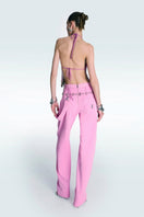 Pink high waist pants by Zeynep Tosun, shown on a model, featuring a tailored fit and stylish design.