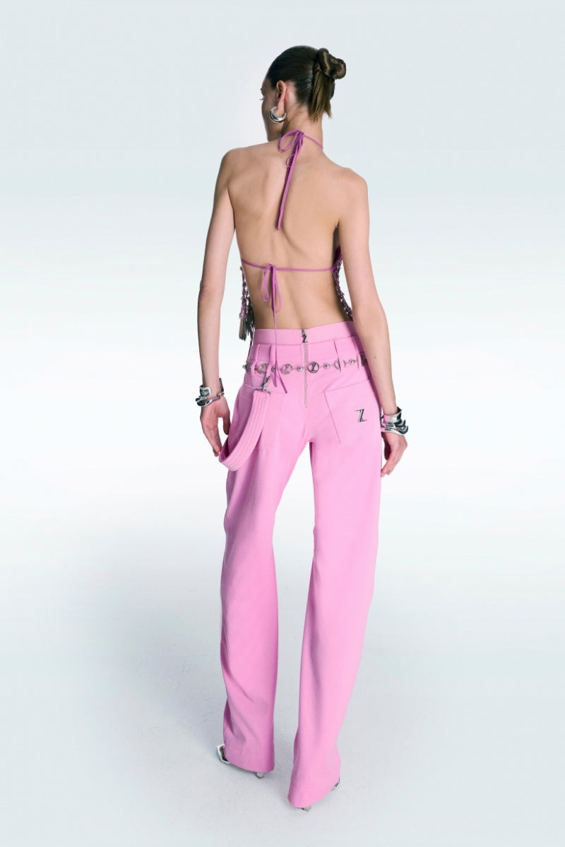 Pink high waist pants by Zeynep Tosun, shown on a model, featuring a tailored fit and stylish design.