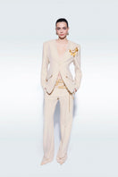 Beige Zeynep Tosun pants with matching belt, tailored fit, and stylish design, shown on a model.
