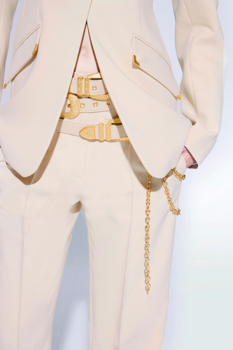 Beige Zeynep Tosun pants with matching belt, tailored fit, and stylish design, shown on a model or flat lay.