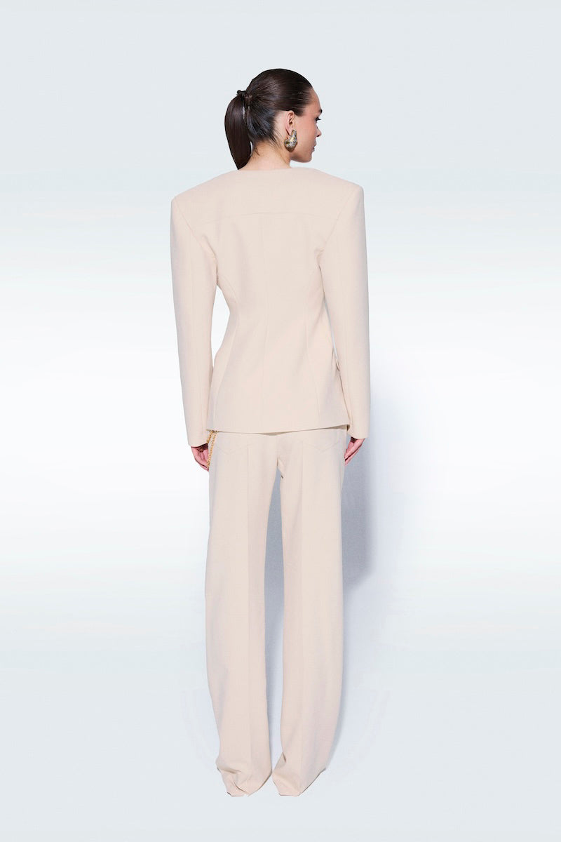 Beige Zeynep Tosun pants with matching belt, tailored fit, featuring side pockets and stylish design.