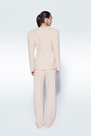 Beige pants with belts by Zeynep Tosun, featuring a stylish tailored fit and belt details, shown on a model.