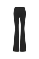 Black wide-leg draped pants by Zeynep Tosun, shown from the back with flowing fabric and relaxed fit.